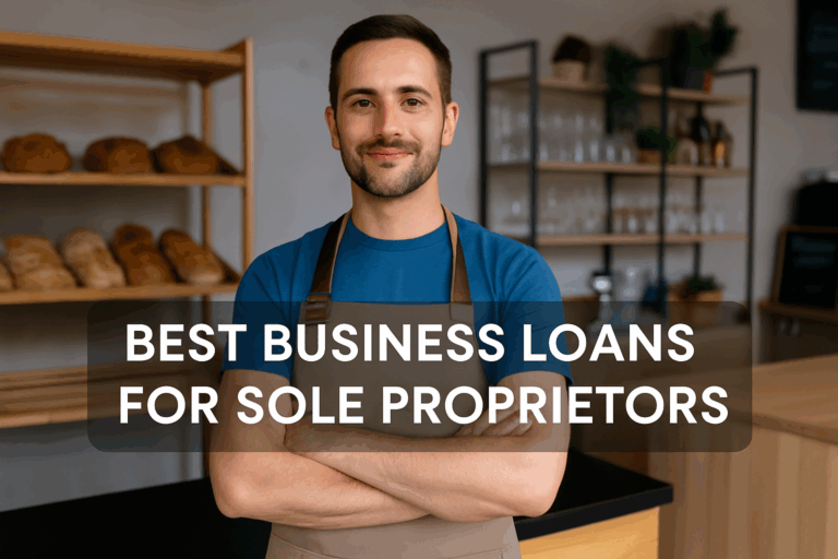 Best Business Loans for Sole Proprietors - Alt text: "Confident sole proprietor wearing a blue shirt and beige apron stands with arms crossed inside a small, well-organized shop with bread on shelves and glassware in the background. A dark transparent overlay displays the white bold text: 'BEST BUSINESS LOANS FOR SOLE PROPRIETORS' across the center."